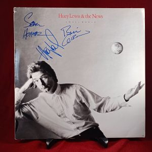 Huey Lewis and the News signed vinyl Small World vinyl record.