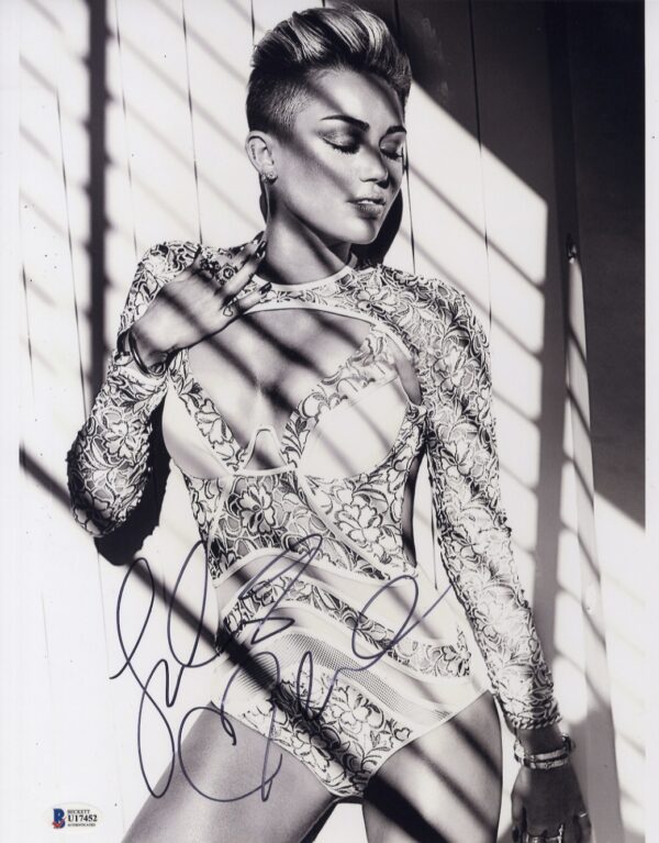 Miley Cyrus signed photo.Shanks Autographs