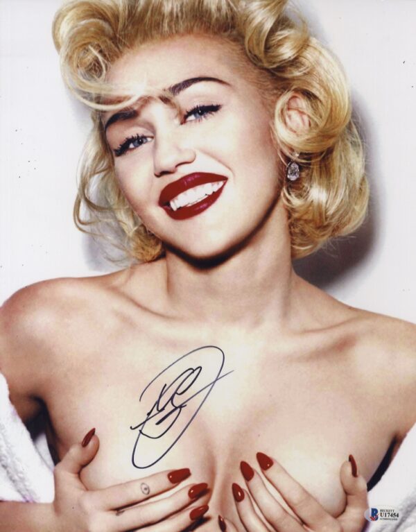 Miley Cyrus signed photo.Shanks Autographs